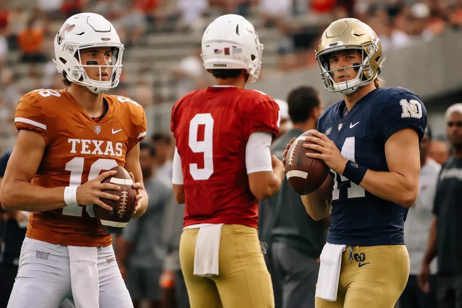 A college football quarterback prepares to take a snap during a game.