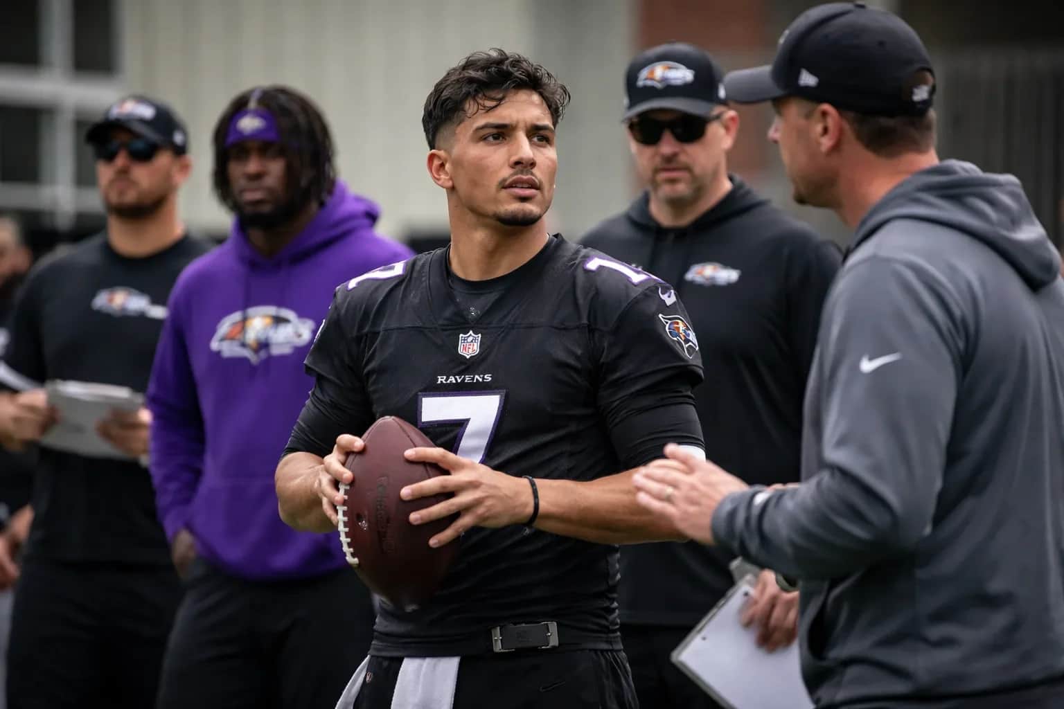 Diego Pavia in a Baltimore Ravens jersey during team drills.