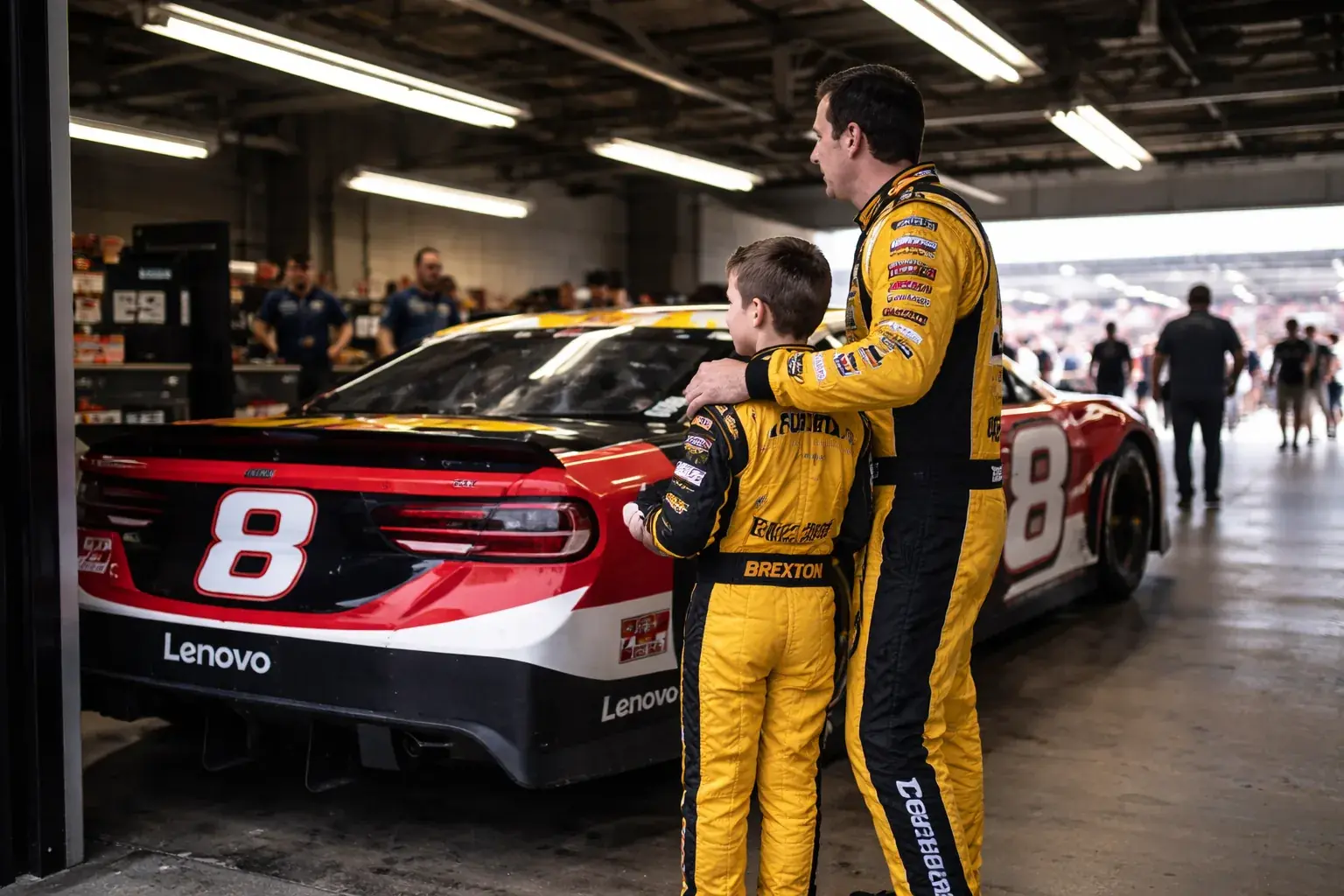 Kyle Busch and his son Brexton standing near the No. 8 Richard Childress Racing Chevrolet.