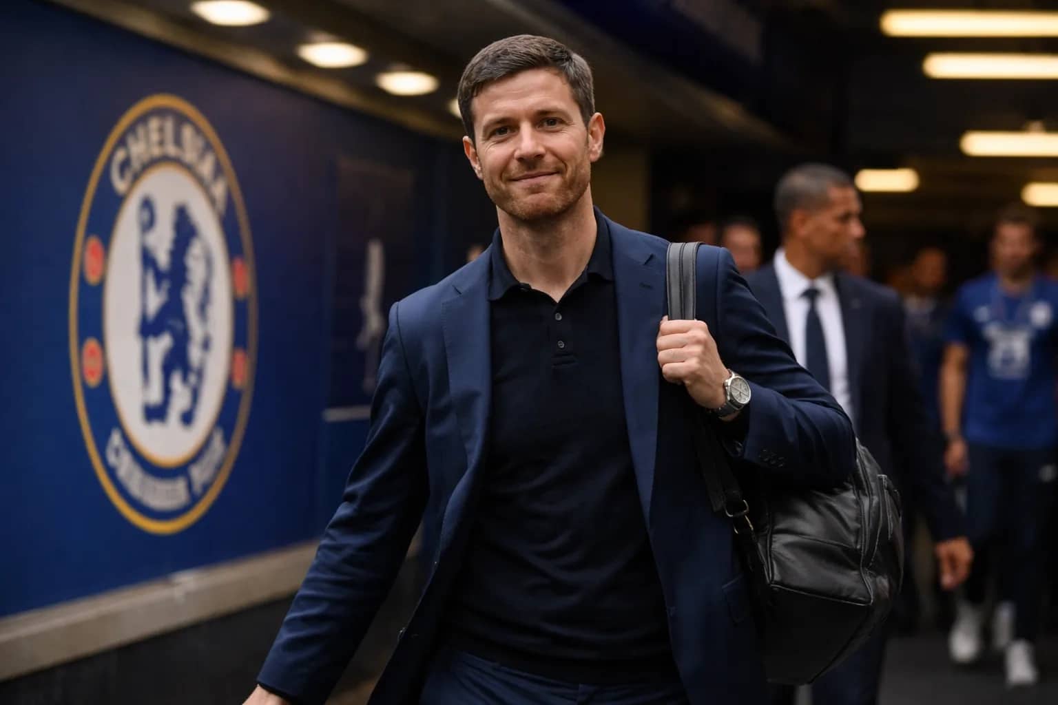 Xabi Alonso coaching on the sidelines during a competitive match.