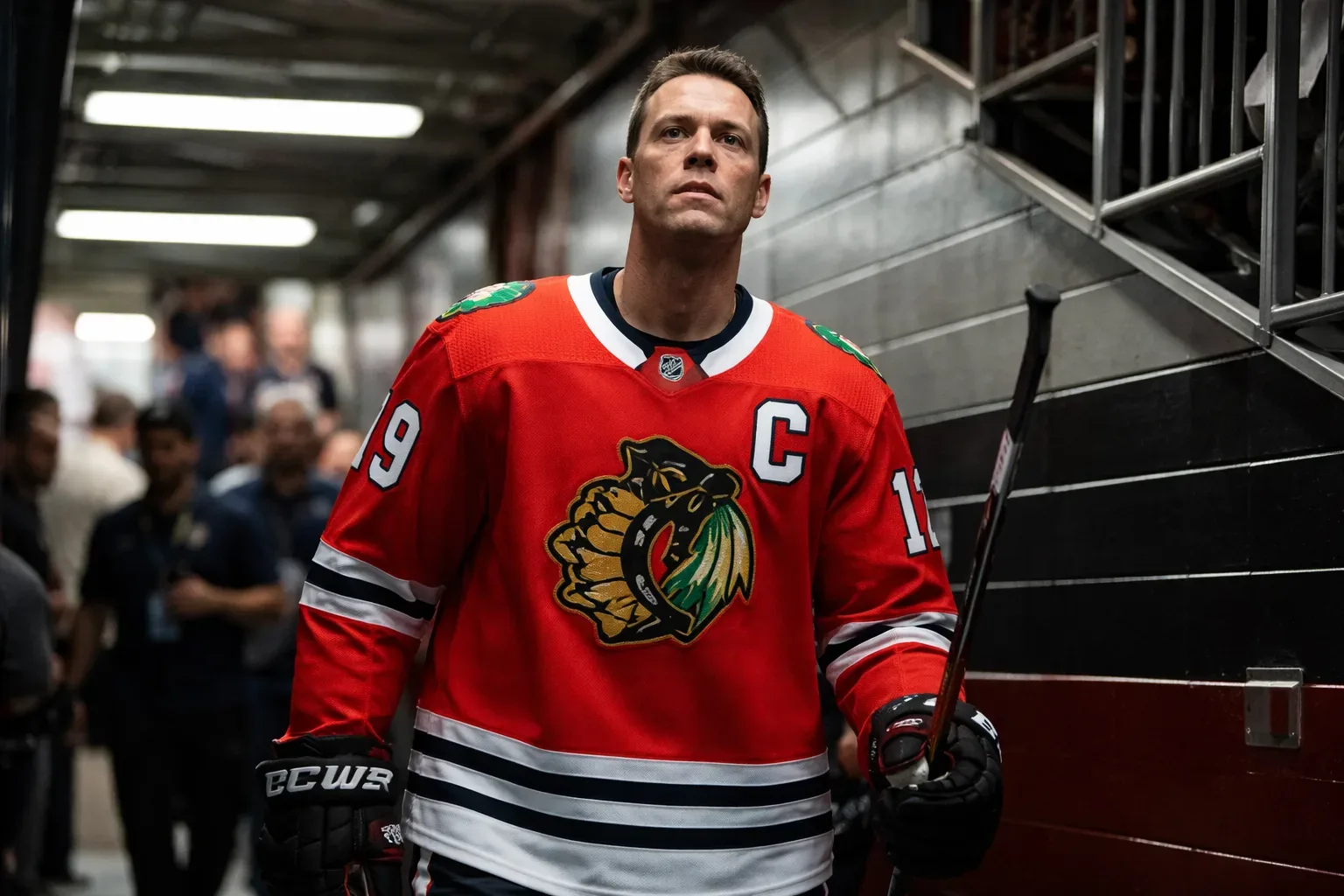 Jonathan Toews raising the Stanley Cup during a victory celebration.