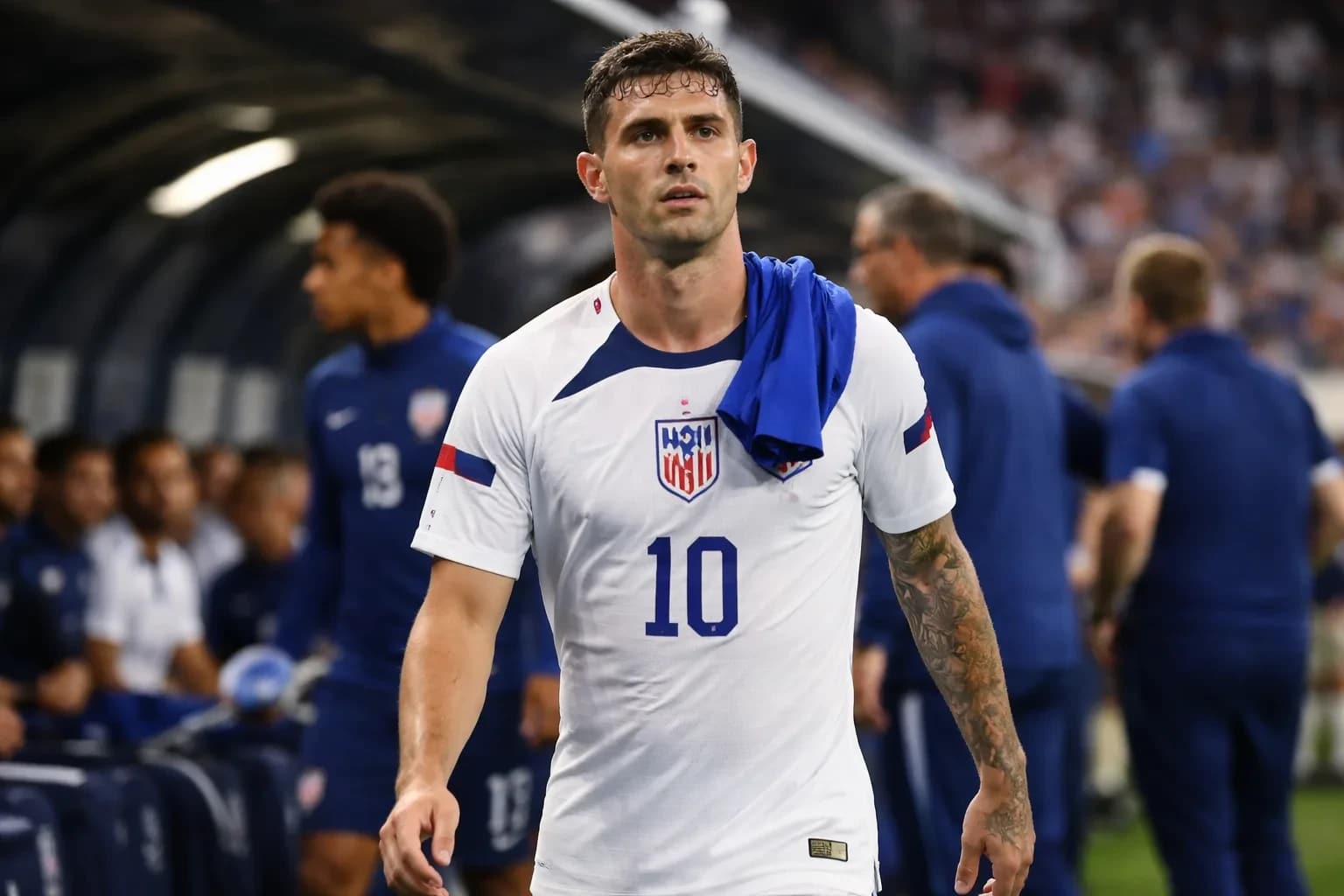 Christian Pulisic and USMNT teammates during a match.