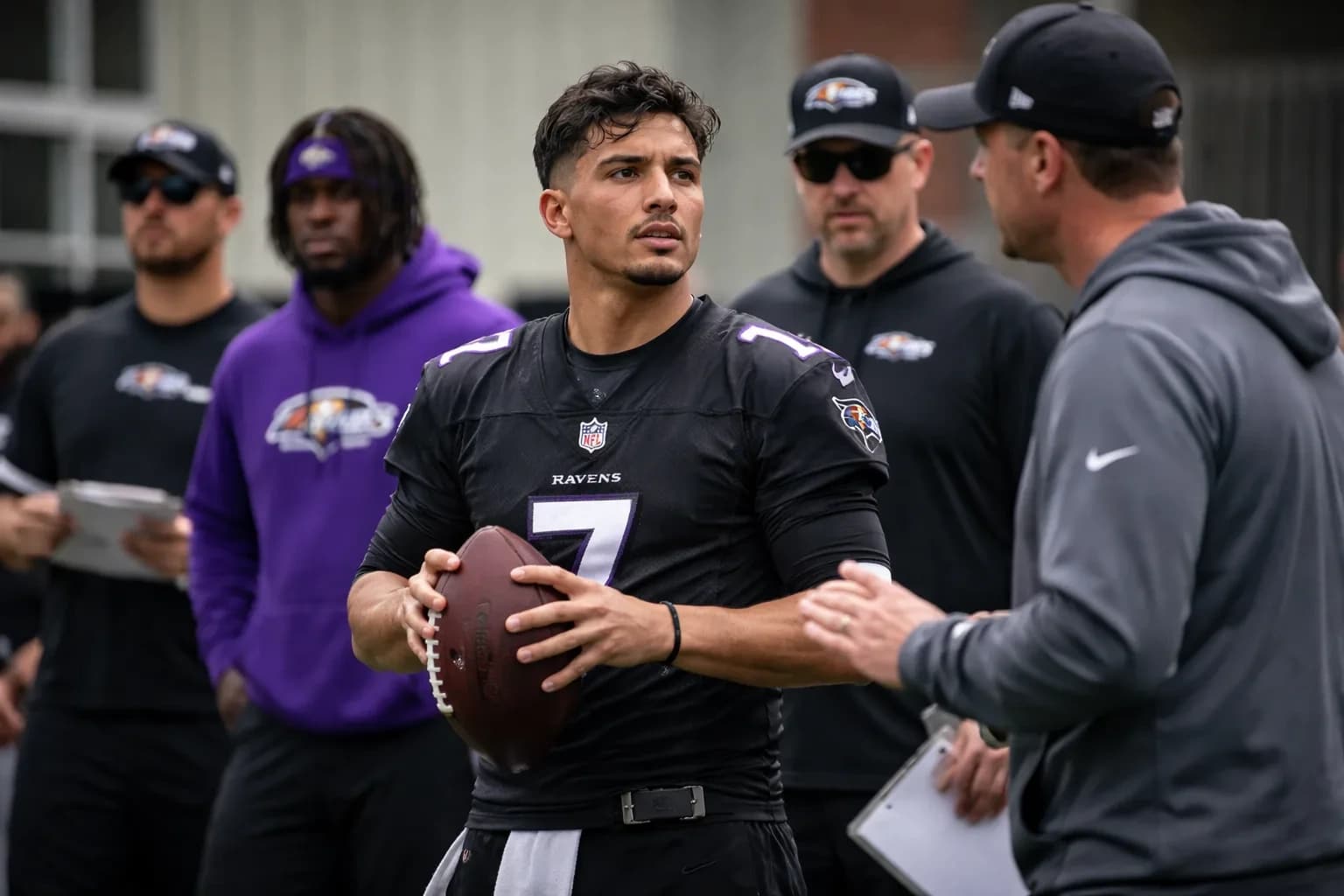 Diego Pavia in a Baltimore Ravens jersey during team drills.