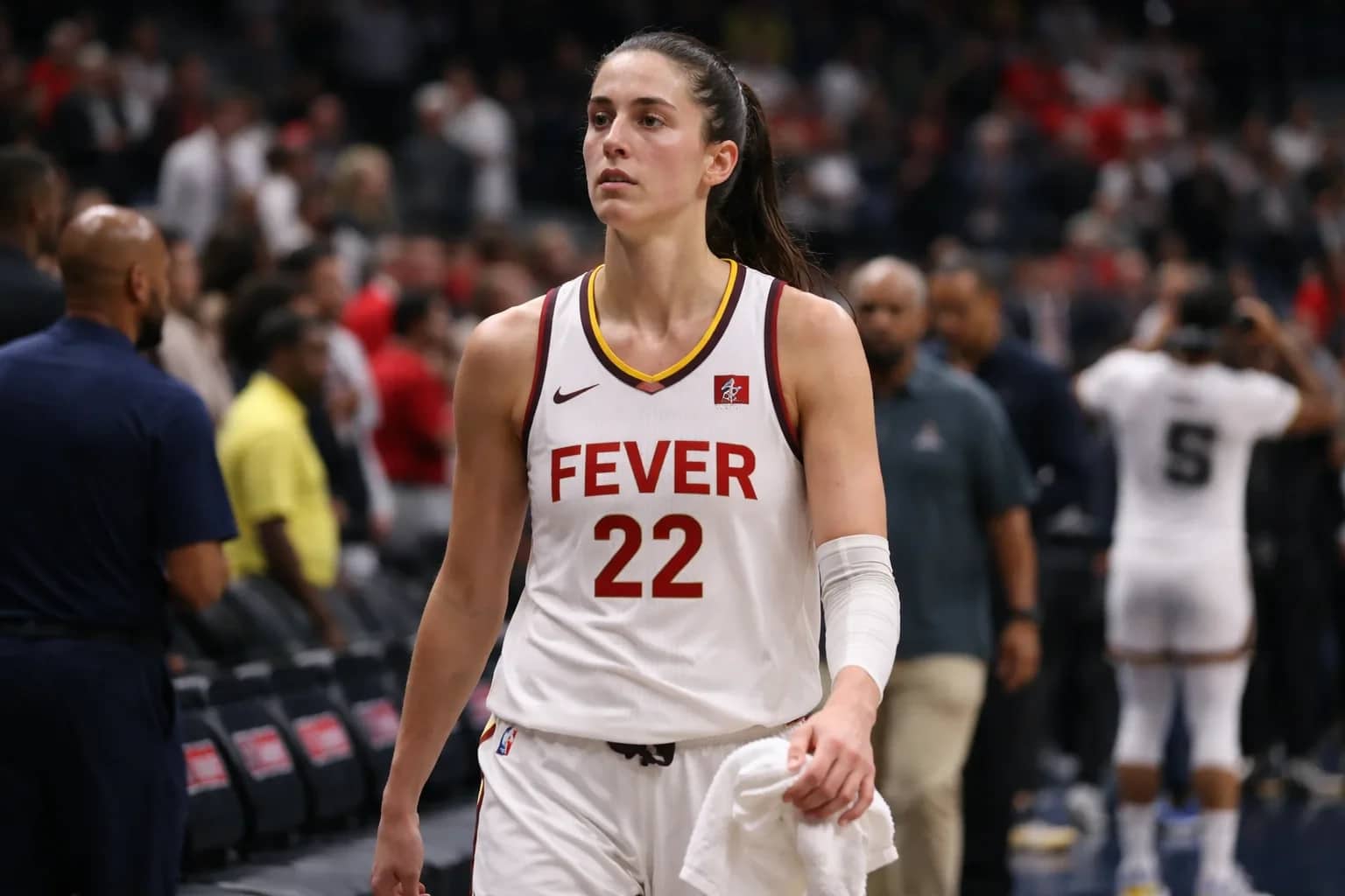 Caitlin Clark shooting a three-pointer for the Indiana Fever.