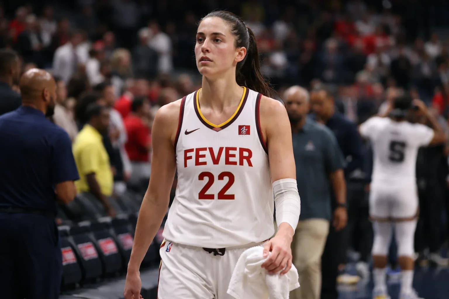Caitlin Clark shooting a three-pointer for the Indiana Fever.
