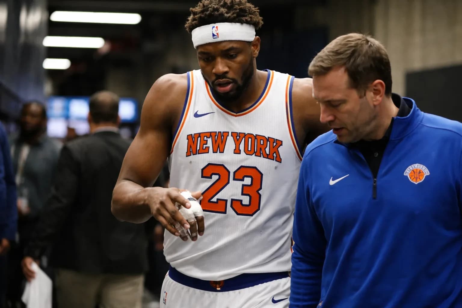Mitchell Robinson of the New York Knicks in a defensive stance during an NBA game.
