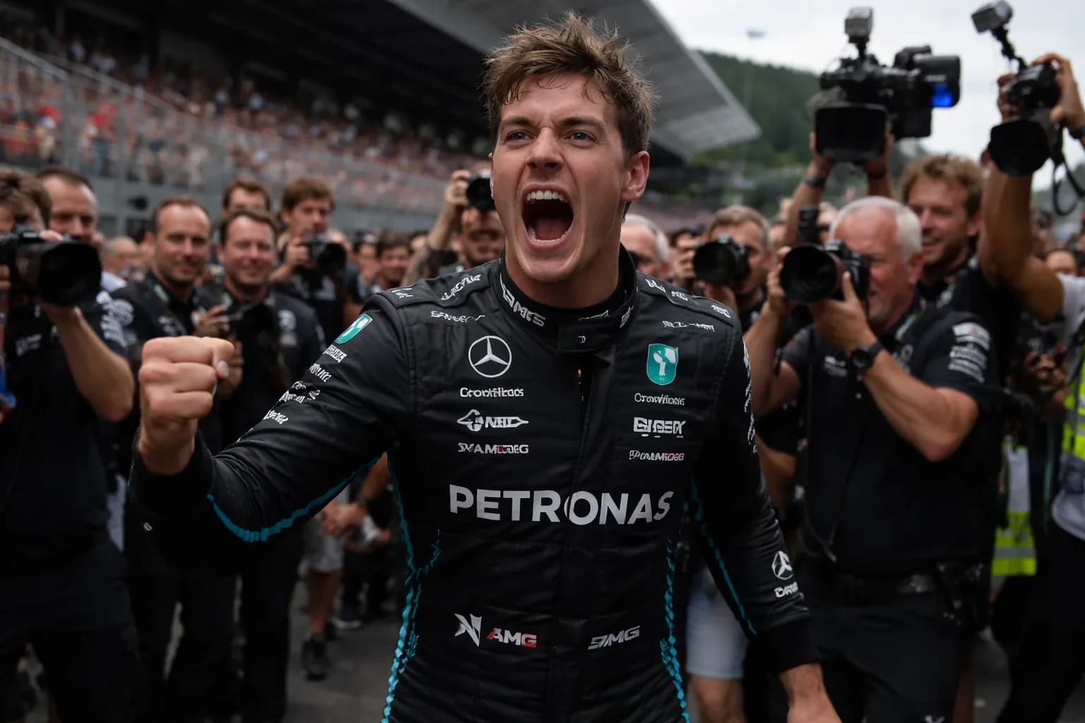 George Russell celebrating his victory on the podium at the Austrian Grand Prix.