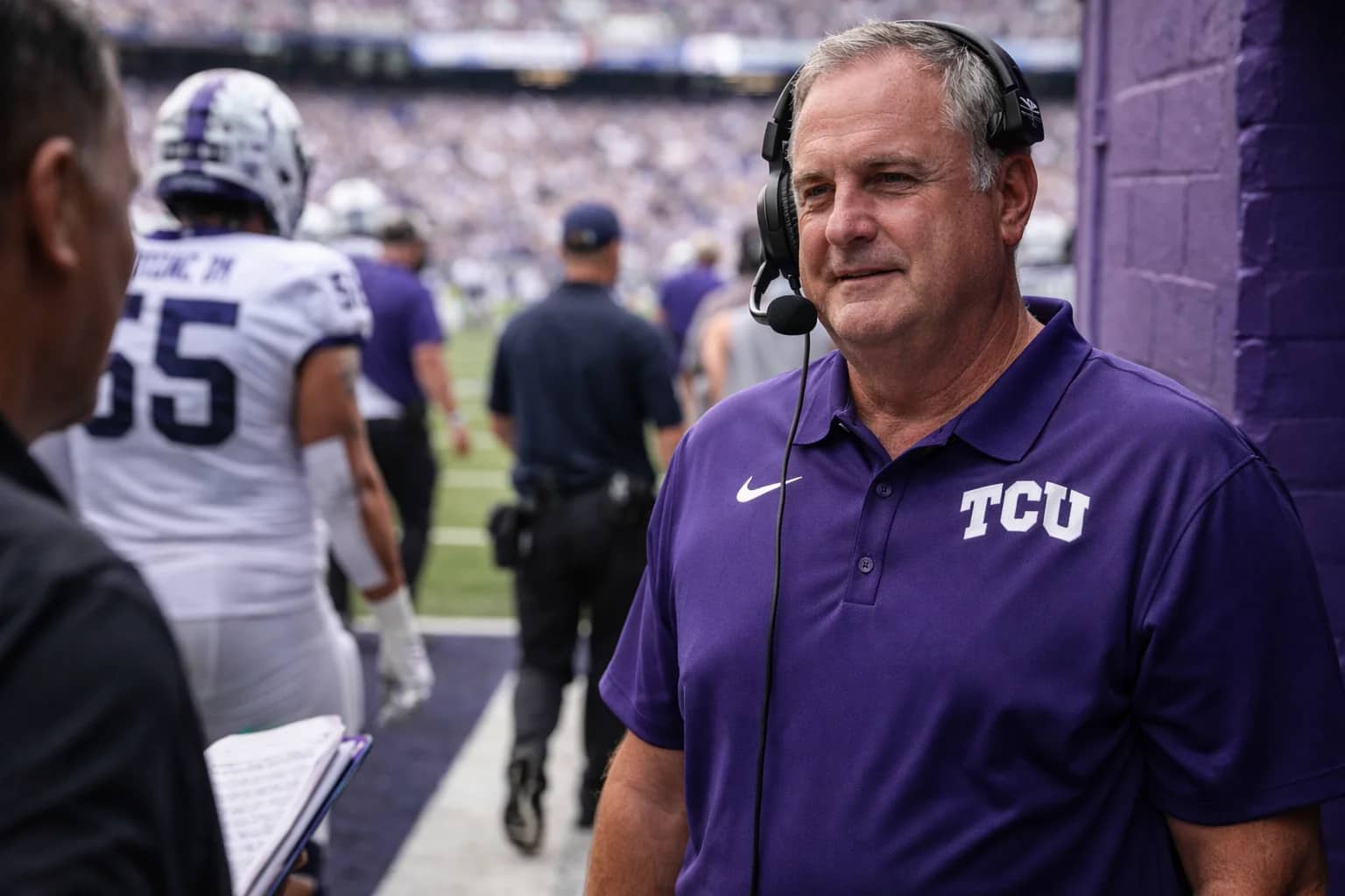 TCU head coach Sonny Dykes on the sideline during a college football game.
