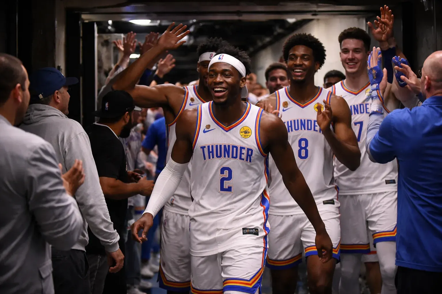Oklahoma City Thunder players huddle during a timeout in a high-stakes playoff game.